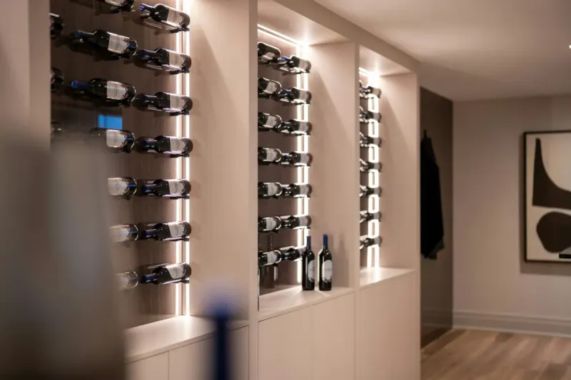 Modern luxury illuminated wine cellar and built-in wine cooler cabinet in a Boston residence