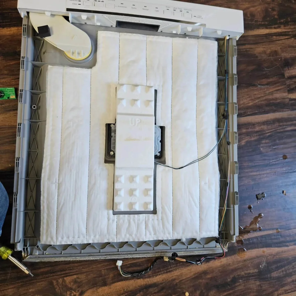 Bosch dishwasher door panel disassembled for dispenser service in Jamaica Plain
