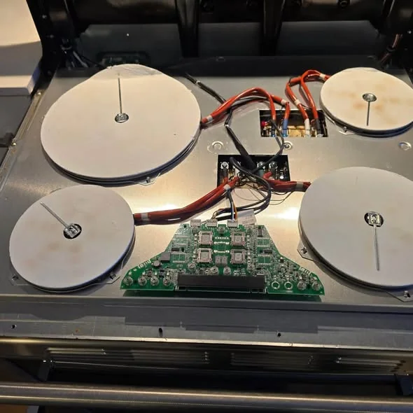 Wolf radiant ceramic cooktop opened showing heating elements in Back Bay