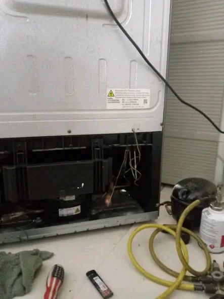 Sub-Zero refrigerator compressor bay brazed with torch in South End Boston